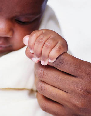 Infant Grasping Mother's Finger